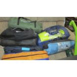 A quantity of camping equipment including tents.