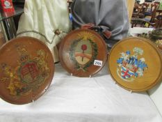 Three mid 20th century hand painted wooden armorial plaques.