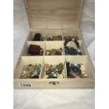 A box containing costume jewellery including old fob, earrings & lighters etc.