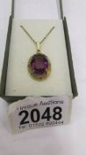 A gilded pendant set large amethyst stone, in good condition.