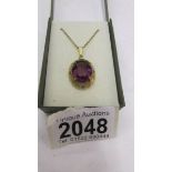 A gilded pendant set large amethyst stone, in good condition.