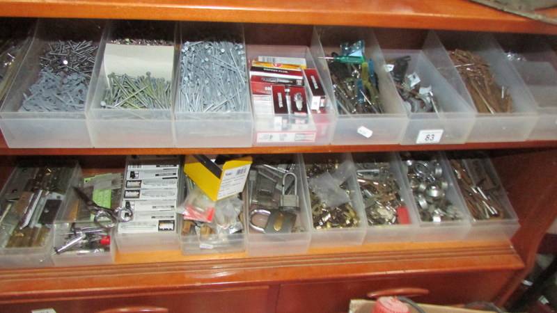 A large quantity of nails, hinges etc.