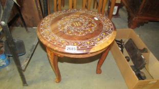 An Indian inlaid barrel table.