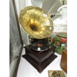 A horn gramaphone with decorative brass horn.