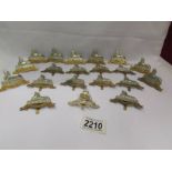 19 modern 'Egypt' cap badges and one other.