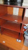 A wood shelving unit, 58 cm wide, 60 cm tall and 30 cm deep. (Collect only).