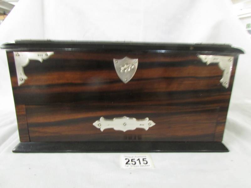 A superb quality 19th century rosewood jewellery box with silver mounts and complete with key,