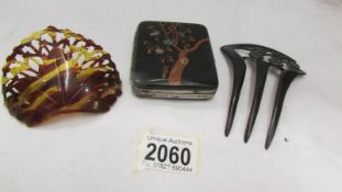 A Japanese lacquered cigarette case, a hair decoration and a hair slide.