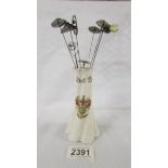 A crested hat pin stand 'Blackpool' with 8 silver hat pins.