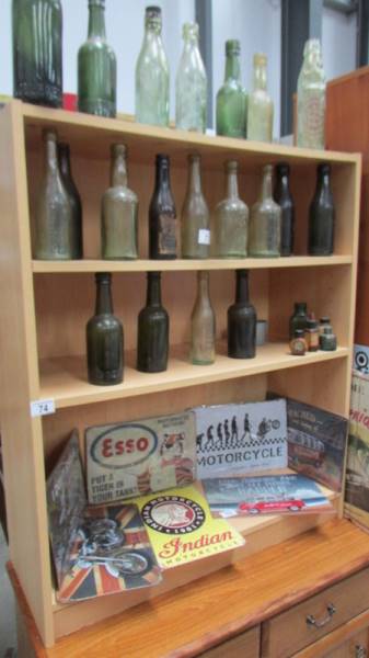 A three shelf pine effect book case.