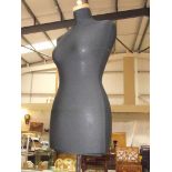 A dressmakers dummy on stand