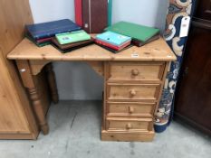 A solid pine single pedestal desk with 4 drawers (94cm x 48cm x 76cm high)