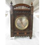 A Winterhald & Hoffmeier mantle clock in oak case.