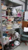 Four shelves of assorted kitchen ware.