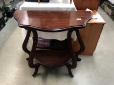 A dark wood stained mahogany effect serpentine edged hall/side table (81cm x 39cm x 75cm high)