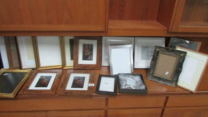 A quantity of mainly new photo frames.