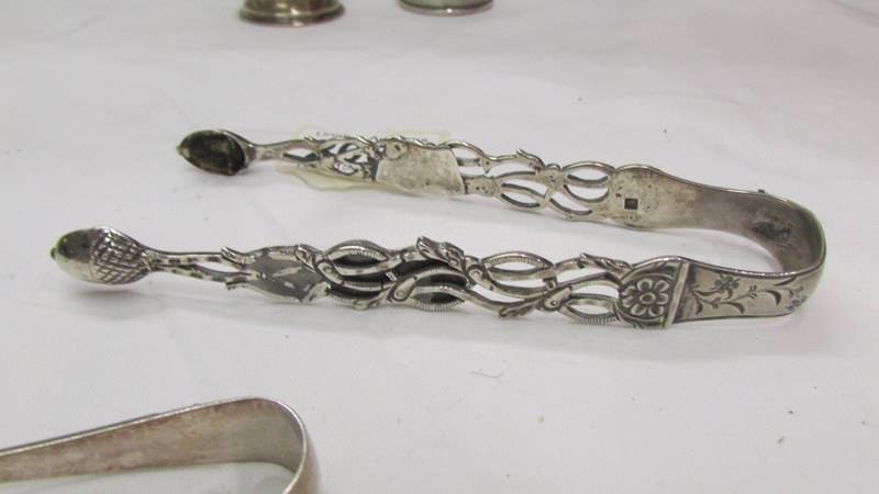 Two hall marked silver sugar tongs and two silver napkin rings. - Image 3 of 4