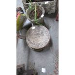 Two planters and 4 circular garden slabs.