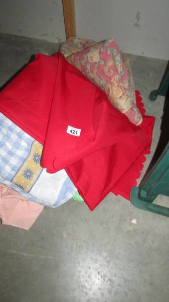 A mixed lot of table cloths etc.