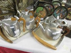 Eight pieces of Piquot tea ware on two trays.