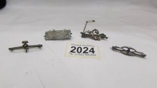 Four old silver brooches including a name brooch (Annie) and a Lincoln Imp.