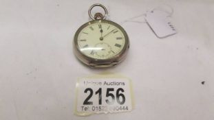 A silver pocket watch in working order.