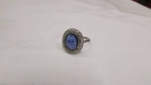 An 18ct white gold large sapphire and diamond ring, size N.