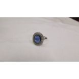 An 18ct white gold large sapphire and diamond ring, size N.