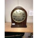 An Edwardian mahogany bracket clock with string inlay & silvered dial, springs ok,