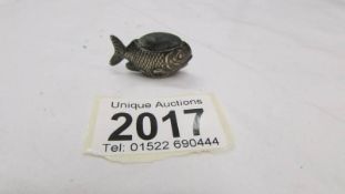 A miniature hall marked silver fish pin cushion.