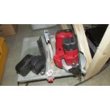 A Champion 18v cordless circular saw with charger and an electric tile cutter.