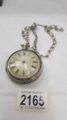A double cased silver Verge pocket watch on silver chain, (chain 54 grams, outer case 31 grams.