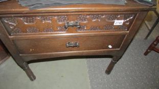 A two drawer chest,