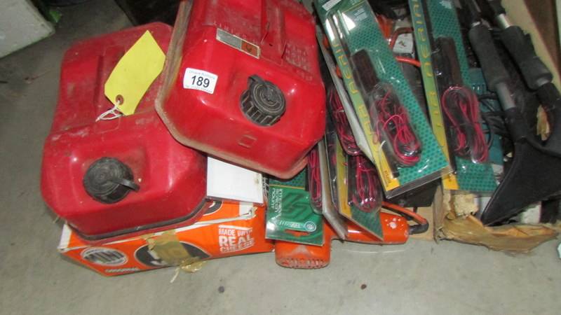 A mixed lot of fuel cans, car ariels etc.