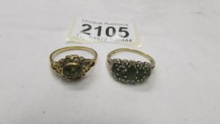 Two 9ct gold rings set green stones, sizes T half and U.