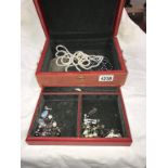 A jewellery box containing pearl necklaces,