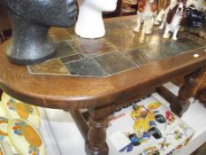 A heavy oak coffee table with slate centre