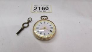 A 14ct gold ladies fob watch with fine chased case, in working order.