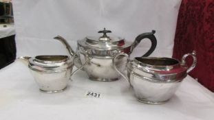 A three piece silver plate tea set.