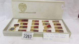 A boxed set of Soviet Union CCCP pin badges, 17 badges in total possibly showing Republic flags.