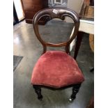 A Victorian mahogany balloon back chair with turned legs