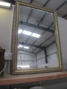 A large gilt framed bevel edge mirror 71 x 102 cm