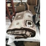A large crocheted throw