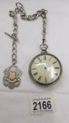 A double cased silver Verge pocket watch on silver chain with silver fog marked T M Jackson,