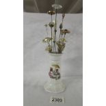 A hat pin stand with 15 hat pins.