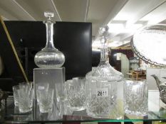 Two good glass decanters and 2 sets of 6 glasses.