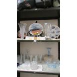 Two shelves of collector's plates and glassware. (Collect only).