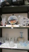 Two shelves of collector's plates and glassware. (Collect only).