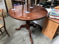 A dark stained pine circular kitchen table, 90 cm diameter, 77 cm high.