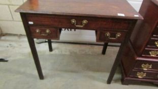 A period oak lowboy with brass handles, in good condition,